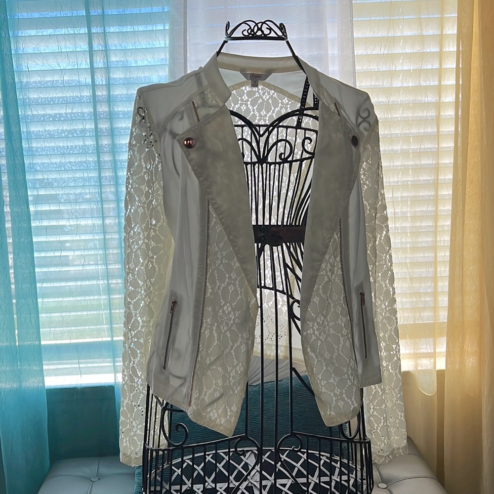 Crème colored lace zip up coat.